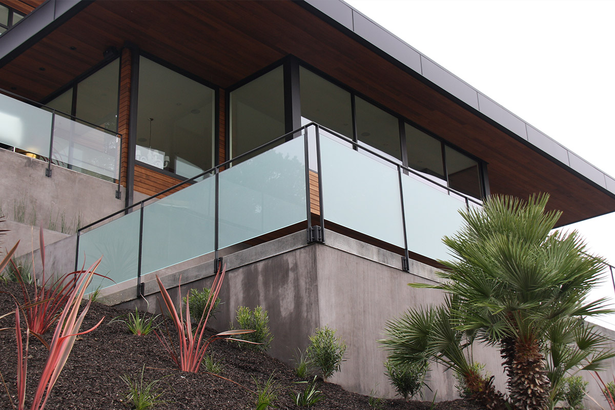 Hilltop house with glass infill railing