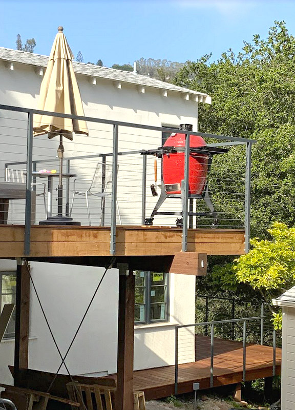 custom porch cable railing with fascia-mounted hardware and powder-coated posts