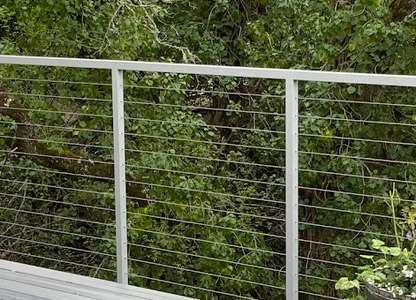stainless steel cable railings installed on a deck