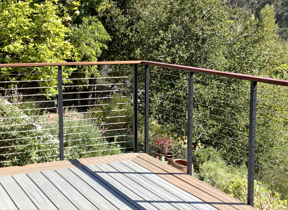 sleek cable railings installed on deck by our pros
